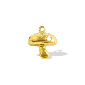 Detailed macro view of a golden mushroom pendant charm for DIY jewelry necklace