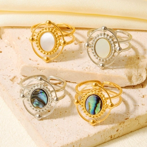 Vintage 18K gold and silver open rings set with natural shell and abalone inlay