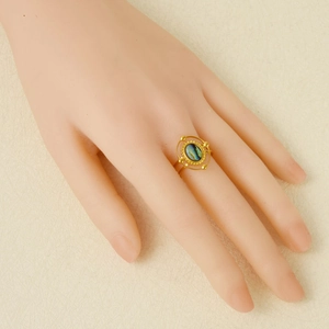 Vintage 18k gold plated stainless steel ring with oval abalone shell stone on finger