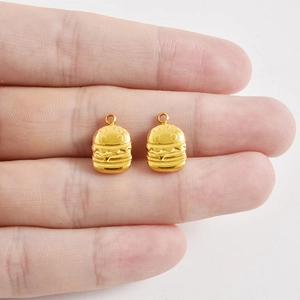 18K gold plated stainless steel hamburger pendant charm held in hand for jewelry making
