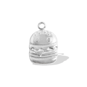 Macro shot of a silver hamburger pendant showing detailed layers for DIY jewelry design