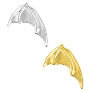 Detailed view of polished gold and silver bat wing metal charms for jewelry making