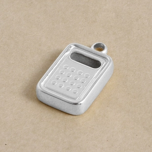 Detailed view of a silver stainless steel mini calculator pendant for DIY jewelry making