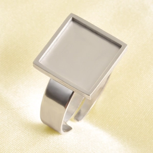 Macro view of adjustable silver square bezel ring base for DIY jewelry making and setting