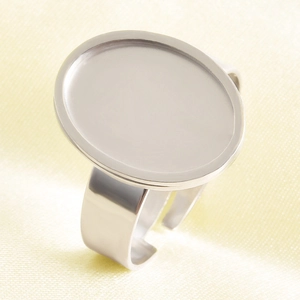 Macro shot of adjustable silver stainless steel ring base with oval flat tray for DIY jewelry