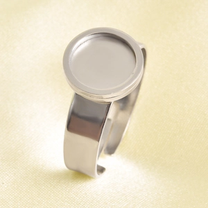 Close-up of adjustable silver-plated round bezel ring base for DIY jewelry making