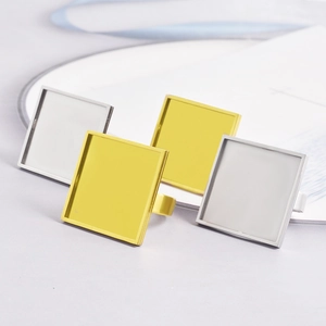 Macro detail of square stainless steel ring base trays for custom DIY jewelry making