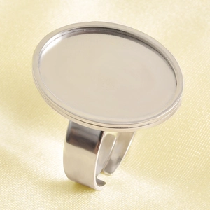 Macro shot of polished silver oval ring base with adjustable band for DIY jewelry crafts