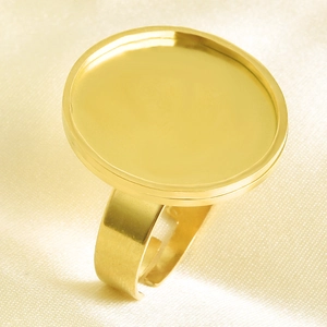 Macro detail of adjustable gold-plated round base ring blank for DIY jewelry making