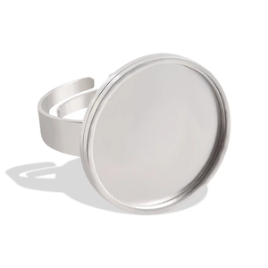 Macro detail of adjustable silver stainless steel ring base with a flat round tray for DIY