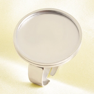 Close-up of adjustable silver stainless steel ring base with flat round tray for DIY jewelry