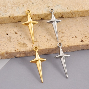 Detailed close-up of 18k gold and silver star cross pendants for DIY jewelry making