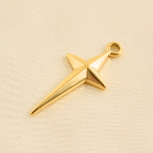 Minimalist 18k gold-plated star pendant with polished mirror finish on silk background