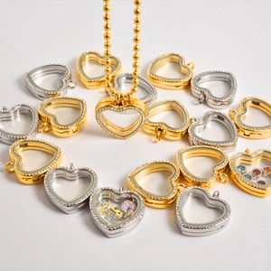 Heart-shaped floating locket pendant with sparkling rhinestones in gold and silver finish