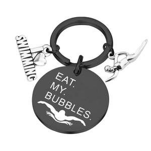 Detail of stainless steel swimming keychain with Eat My Bubbles and heart charms