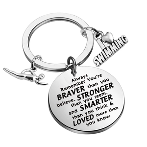Polished stainless steel swimming keychain with athlete charm and inspiring words
