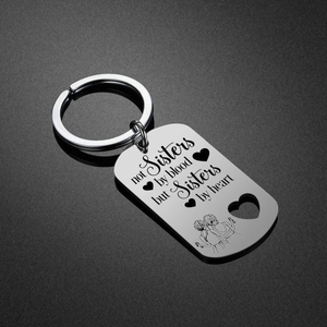 Stainless steel sisters keychain with heart cutout and engraved friendship quote