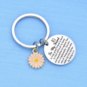 Friendship keychain with stainless steel engraved quote tag and pink daisy pendant