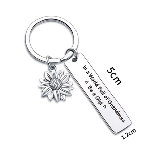 Grandma sunflower keychain with engraved Gigi metal plate on a clean white background