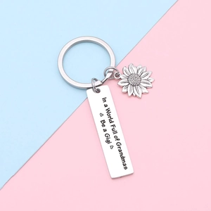Polished stainless steel Gigi keychain with engraved message and sunflower pendant