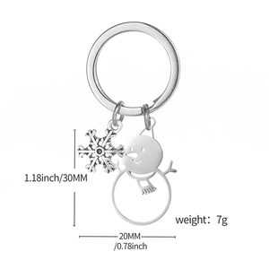 Detailed view of snowman and snowflake metal charms on keychain with dimensions in inches
