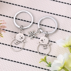 Cute snowman and snowflake stainless steel keychains in a winter themed gift set