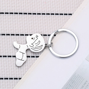 Detailed macro shot of the silver cartoon character pendant with classic metal keyring
