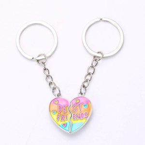 Detail of colorful gradient Best Friends heart split keychains with enamel finish