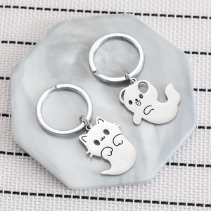 Cute ghost cat and dog stainless steel keychains on marble tray for Halloween gift