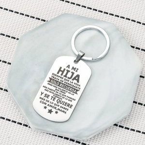 Spanish stainless steel dog tag keychain for daughter with inspirational text on marble