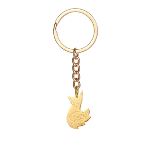 Detailed view of polished gold fox keychain with intricate fur textures and metal ring