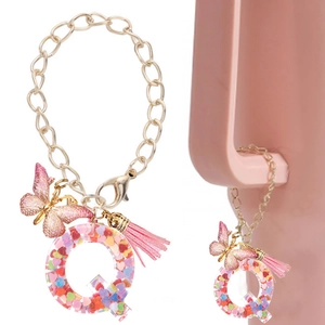 Pink resin letter Q keychain with heart sequins, butterfly charm and silk tassel