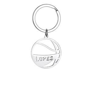 Detailed macro of a hollow basketball keychain in silver metal with LOPES engraving