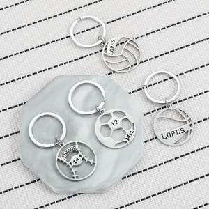 Custom stainless steel sports keychains featuring cutout ball designs and personalized names