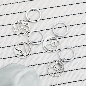 Custom engraved stainless steel sports keychains featuring cutout tennis and soccer designs