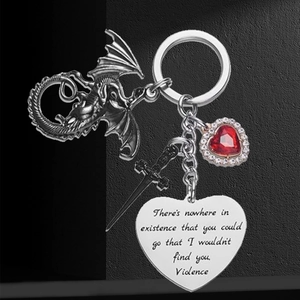 Gothic keychain with vintage silver dragon, black sword, and ruby heart pendant