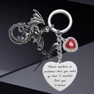 Gothic dragon and sword keychain with a heart-shaped red gemstone pendant and engraved tag