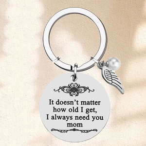 Polished stainless steel mom keychain with engraved quote, wing charm and pearl bead
