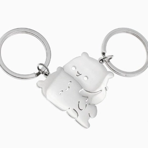 Porte-clés couple en acier inoxydable poli avec design puzzle ours qui s'emboîte