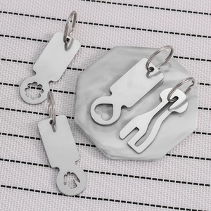 Stainless steel supermarket trolley token set with four unique cutout key ring designs