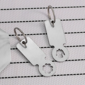 Polished stainless steel trolley token keychains with clover and angel cutouts