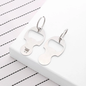 Close-up of stainless steel keychain with cart token and bottle opener function