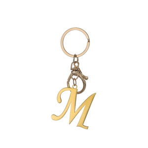 Polished gold initial M keychain with circular ring and lobster clasp on white background