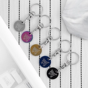 Detail of five-color stainless steel trolley token keychains with laser icons