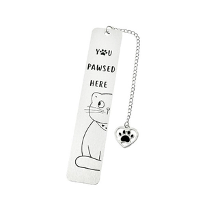 Detail showing stainless steel bookmark with cat engraving and YOU PAWSED HERE text