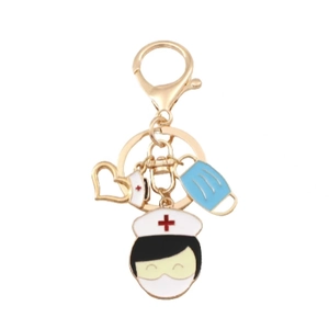 Porte-clés doré en métal avec infirmière, masque médical et décoration en cœur