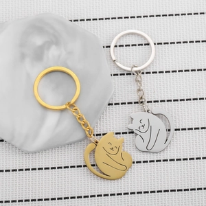 Cute cat-shaped metal keychains in gold and silver finish with polished alloy design