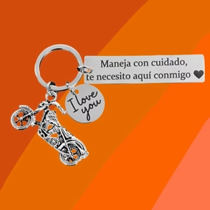 Stainless steel motorcycle keychain with Spanish engraved safety message and heart charm