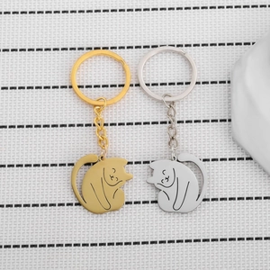 Cute hollow-out cat keychains in gold and silver finish for women's bags or car keys