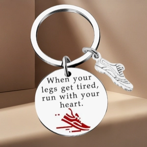 Polished stainless steel soccer keychain with sneakers charm on geometric display stand